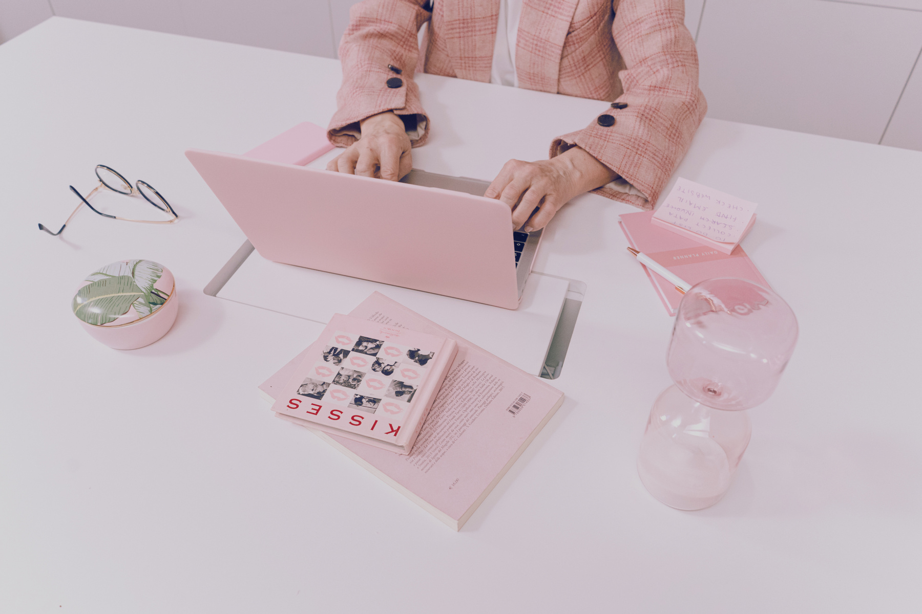 Person in Pink Blazer Using a Ping Computer Laptop