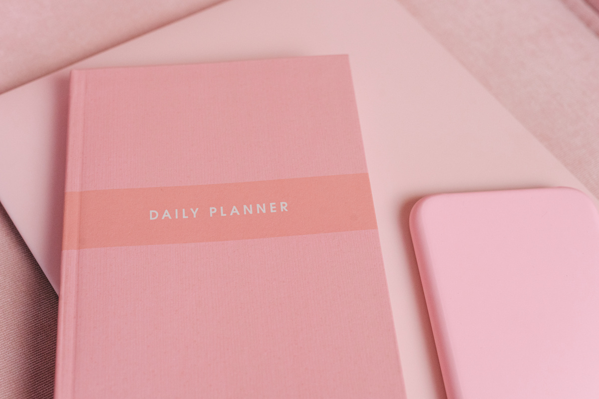 A Pink Planner on the Table